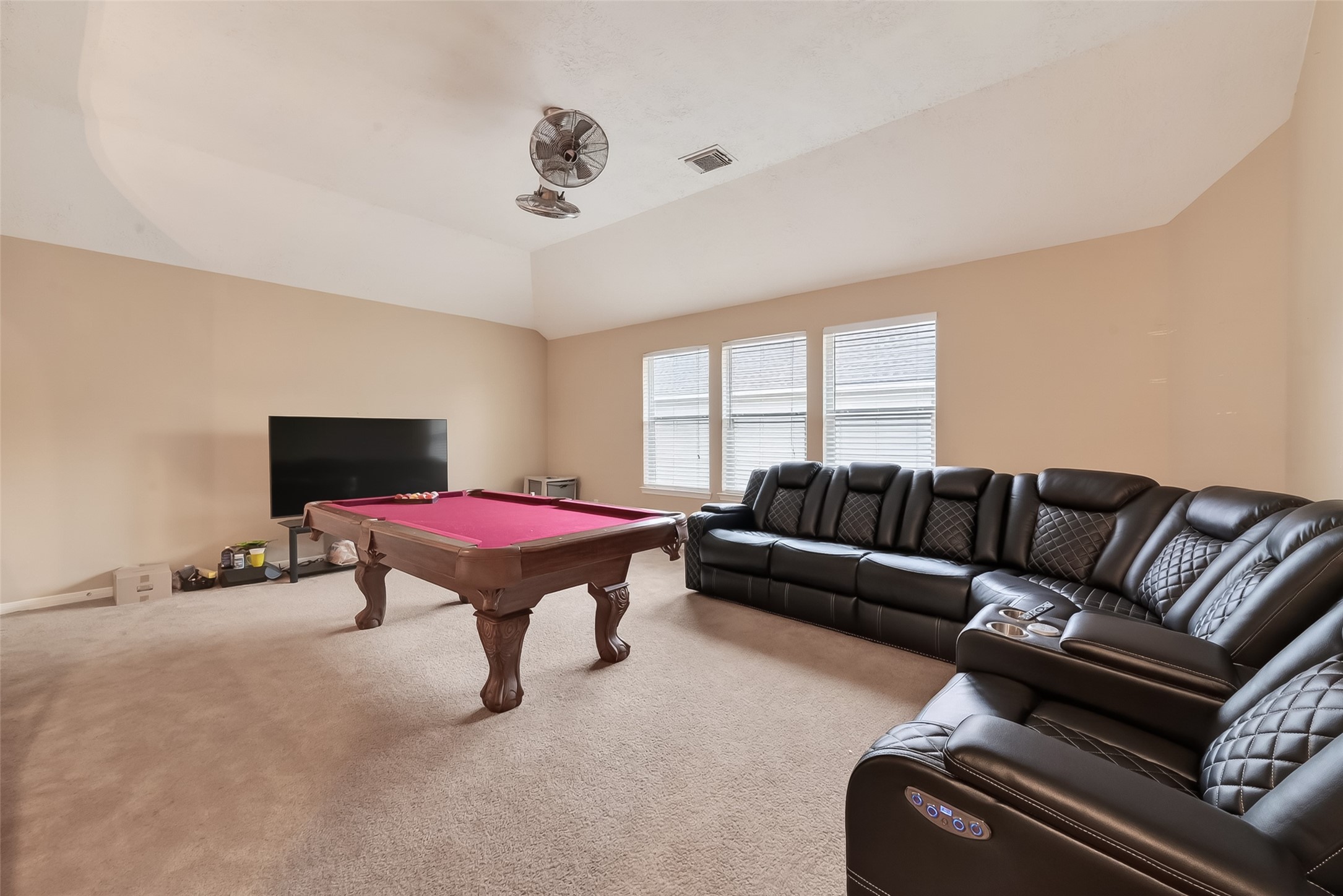 3203 Ruffin Green Court Fresno, TX 77545 - Photo 12 of 20 a living room with furniture a rug and a projector