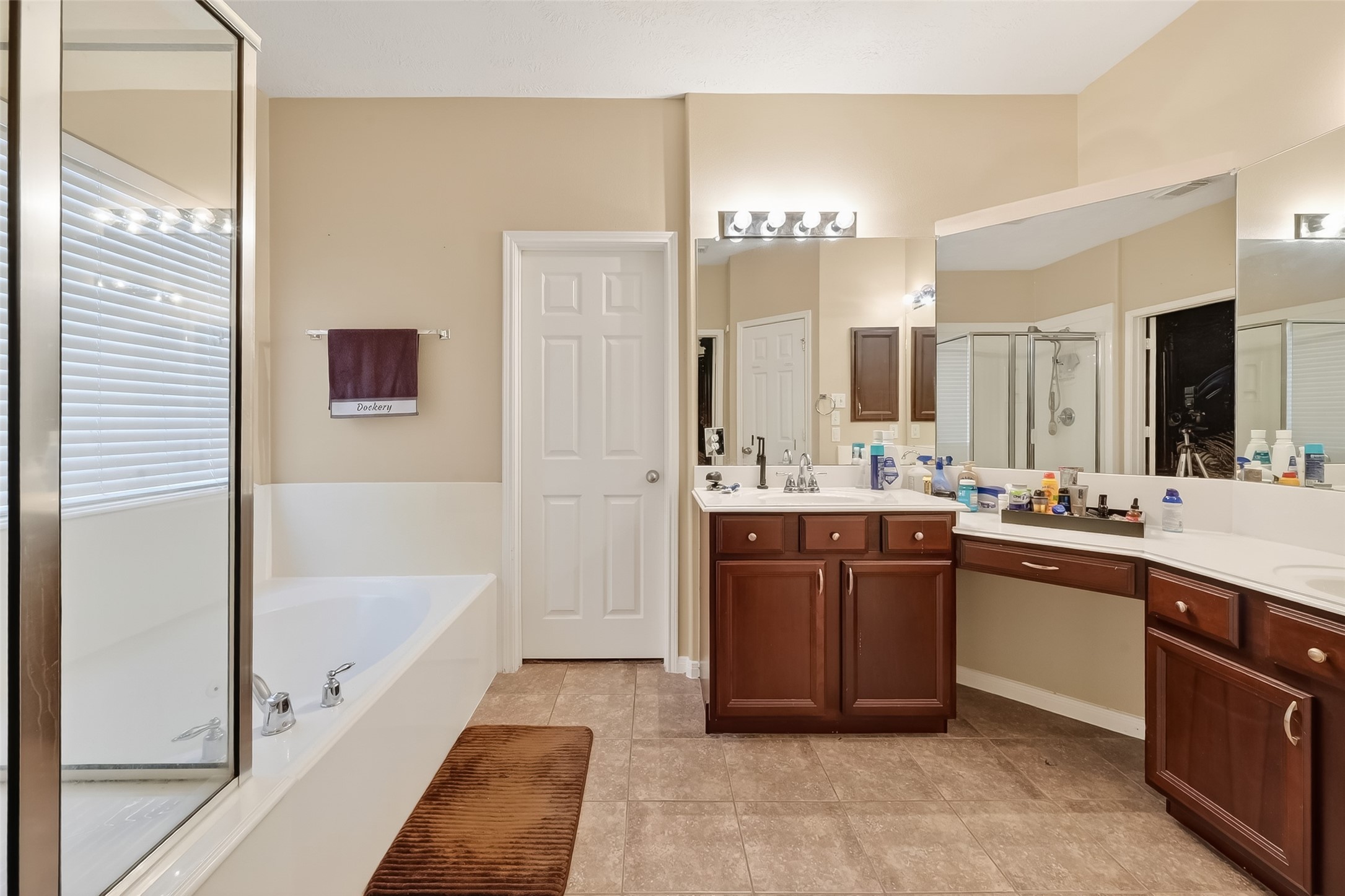 3203 Ruffin Green Court Fresno, TX 77545 - Photo 15 of 20 a bathroom with a tub sink and mirror