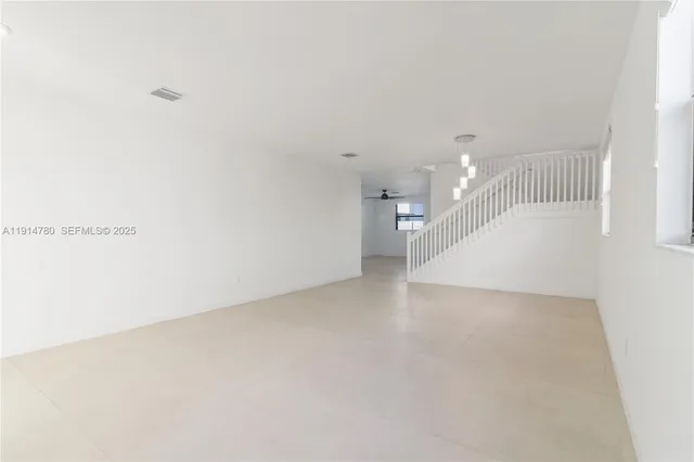 a view of a hallway with staircase