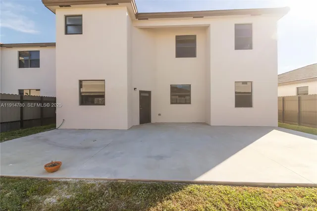 a view of a backyard with a garage
