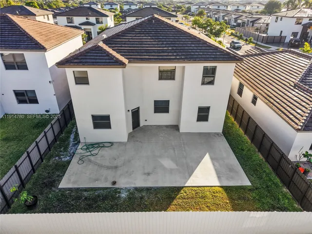 an aerial view of house with yard