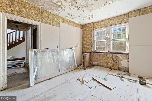 a view of a kitchen with a stove top oven
