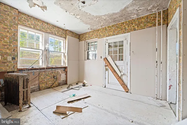wooden floor with furniture and windows