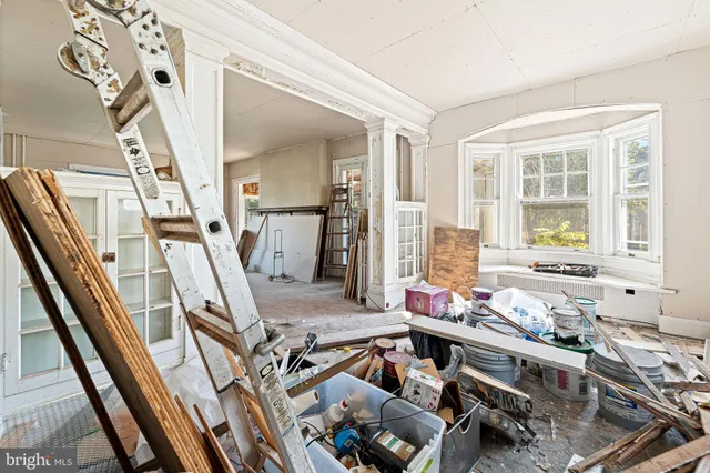 a living room with furniture window and a flat screen tv