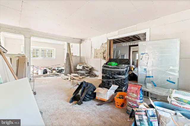 a bathroom with a window and a shower