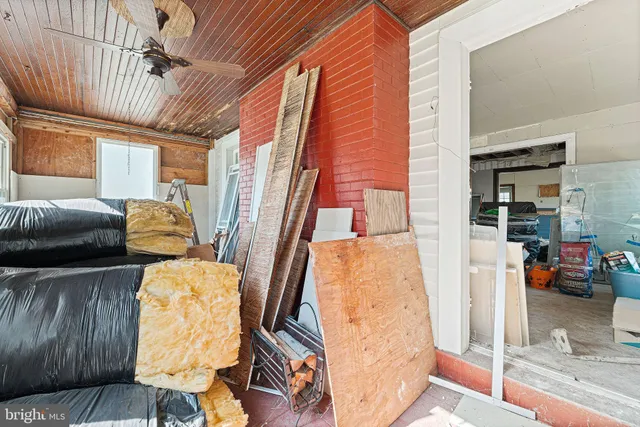 a view of an entryway with wooden floor and door