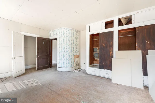 a view of a wooden door with a backyard