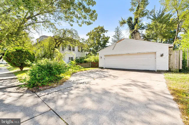 a view of a house with a yard and garage
