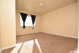 411 West 2000 South, Unit 7 Perry, UT 84302 - Photo 8 of 11 Carpeted room with neutral wall tones and a single window