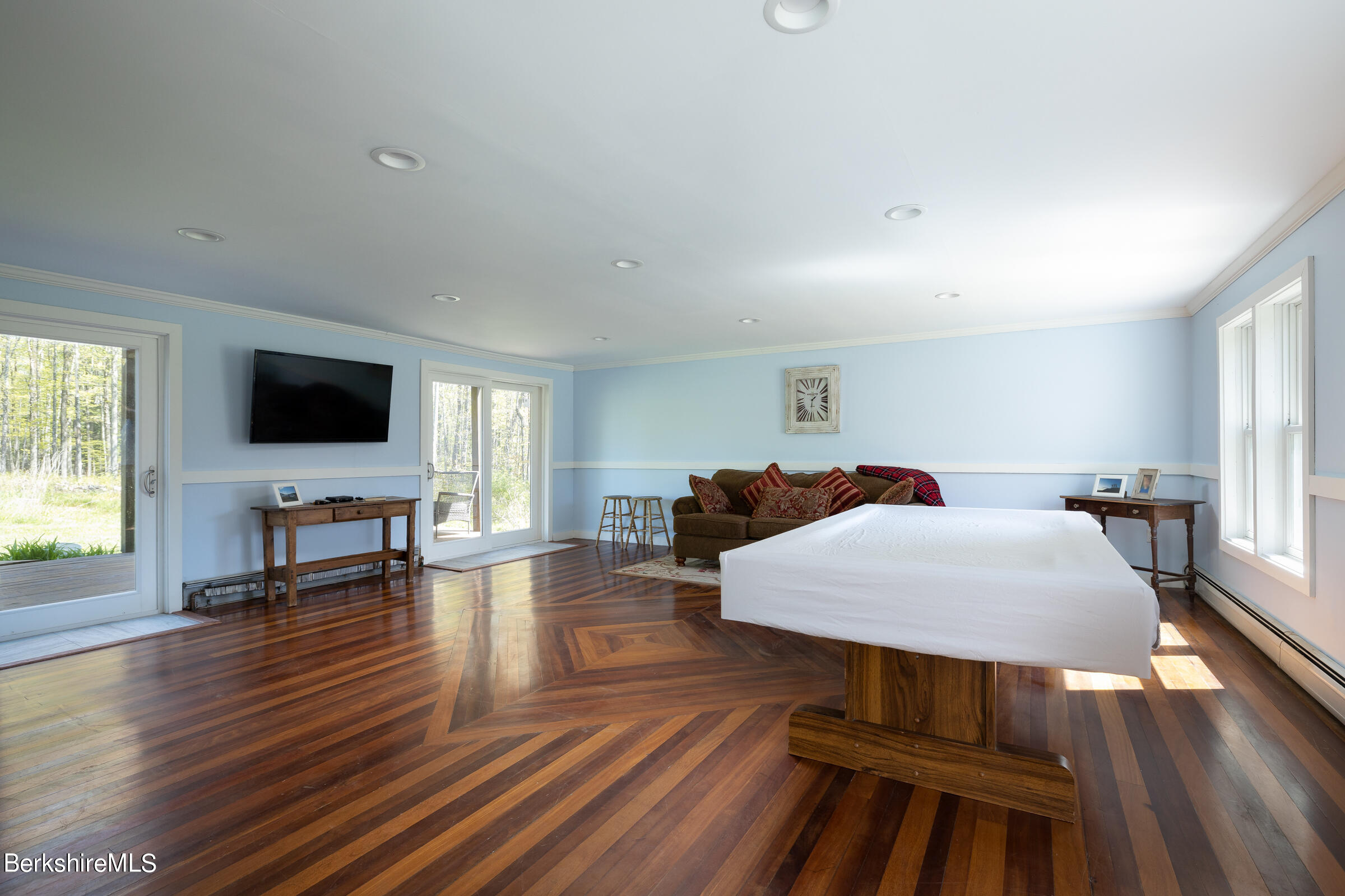 235 Main Road Monterey, MA 01245 - Photo 22 of 37 a living room with furniture and a flat screen tv