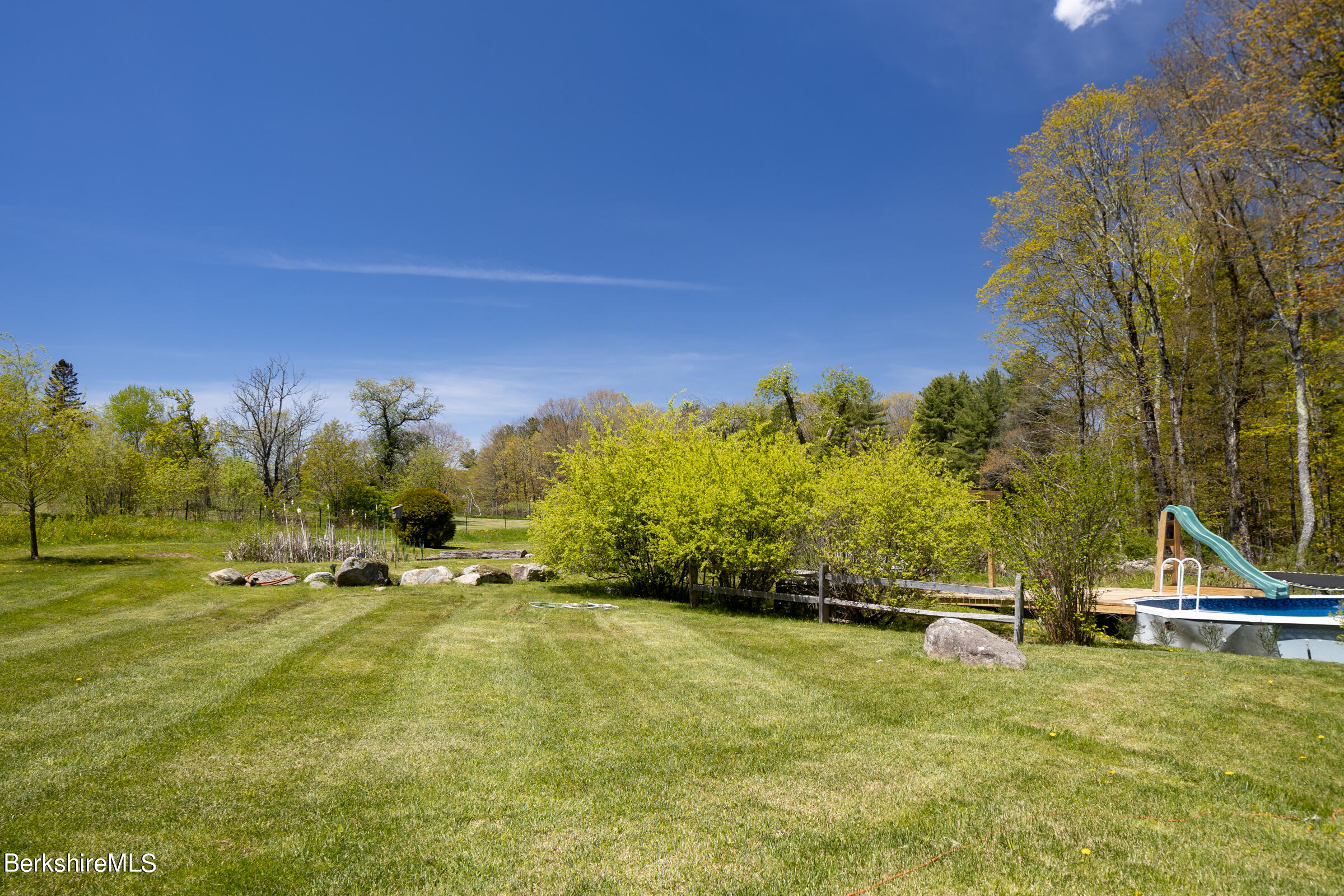 235 Main Road Monterey, MA 01245 - Photo 27 of 37 a swimming pool with trees in the background