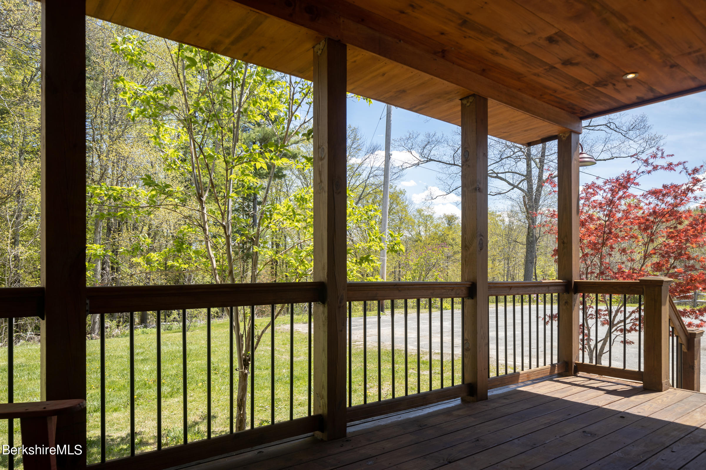 235 Main Road Monterey, MA 01245 - Photo 4 of 37 a view of a large window with wooden floor