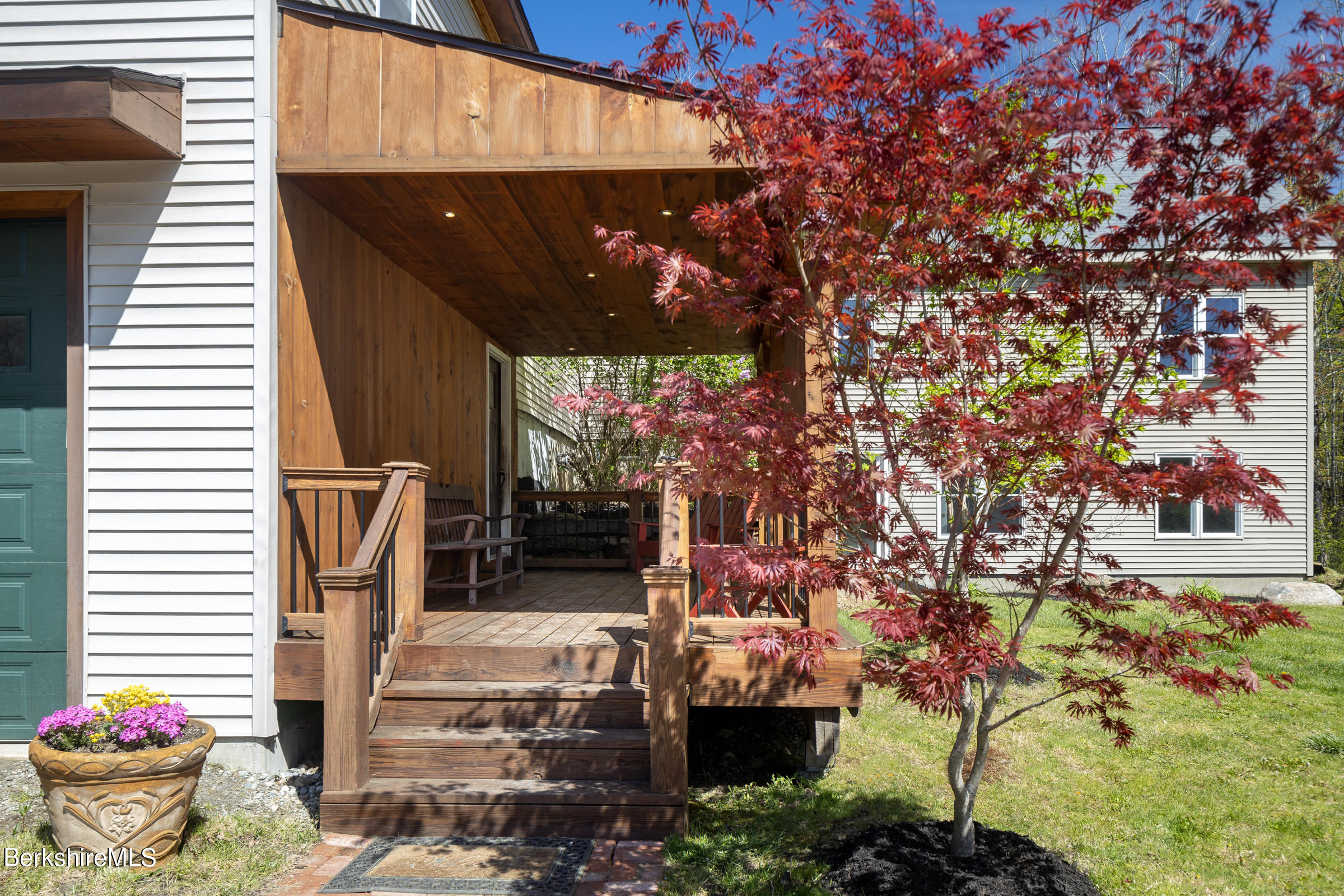 235 Main Road Monterey, MA 01245 - Photo 33 of 37 a front view of a house with plants