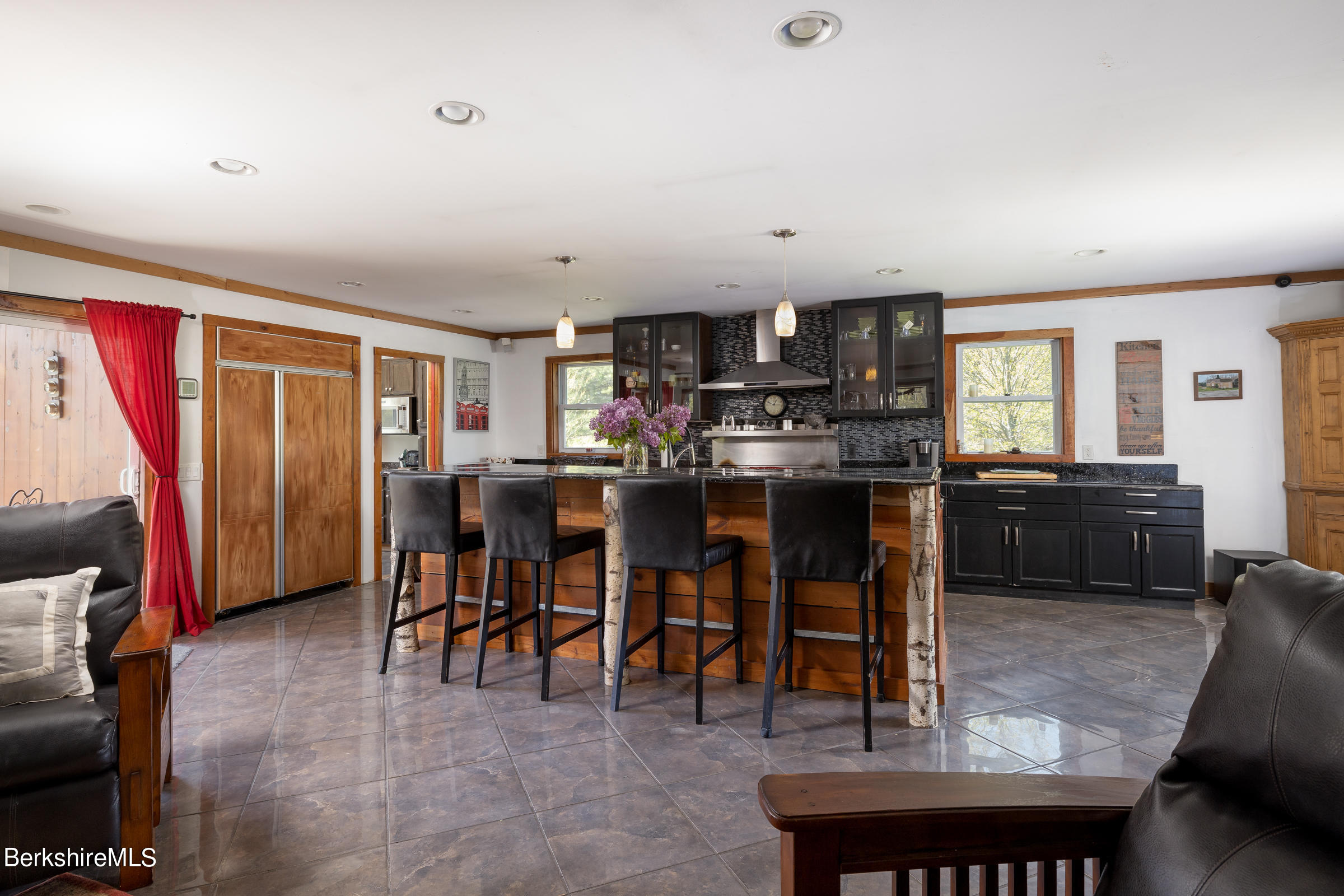 235 Main Road Monterey, MA 01245 - Photo 36 of 37 a living room with stainless steel appliances furniture a rug and a view of kitchen