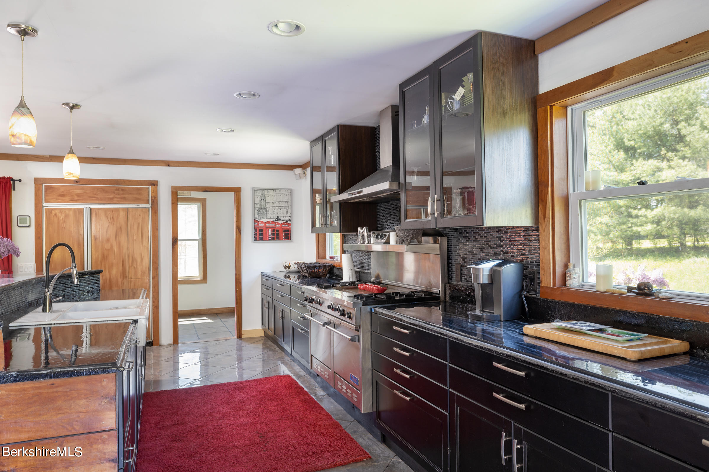 235 Main Road Monterey, MA 01245 - Photo 9 of 37 a kitchen with stainless steel appliances granite countertop a stove and a sink