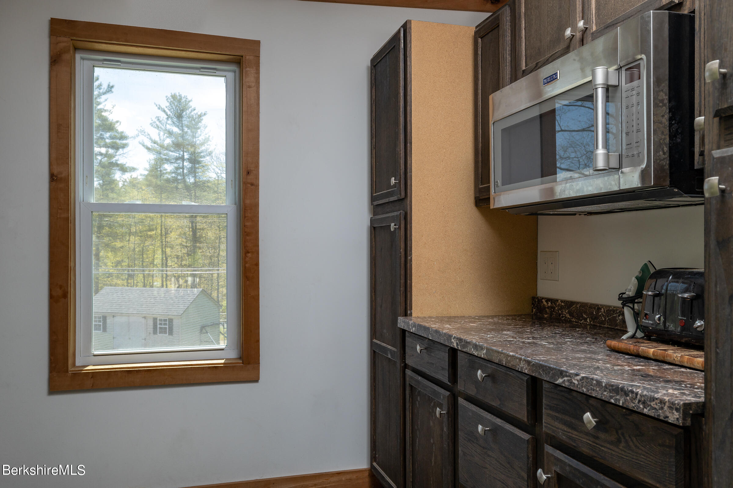 235 Main Road Monterey, MA 01245 - Photo 10 of 37 a kitchen with stainless steel appliances granite countertop a stove and a sink