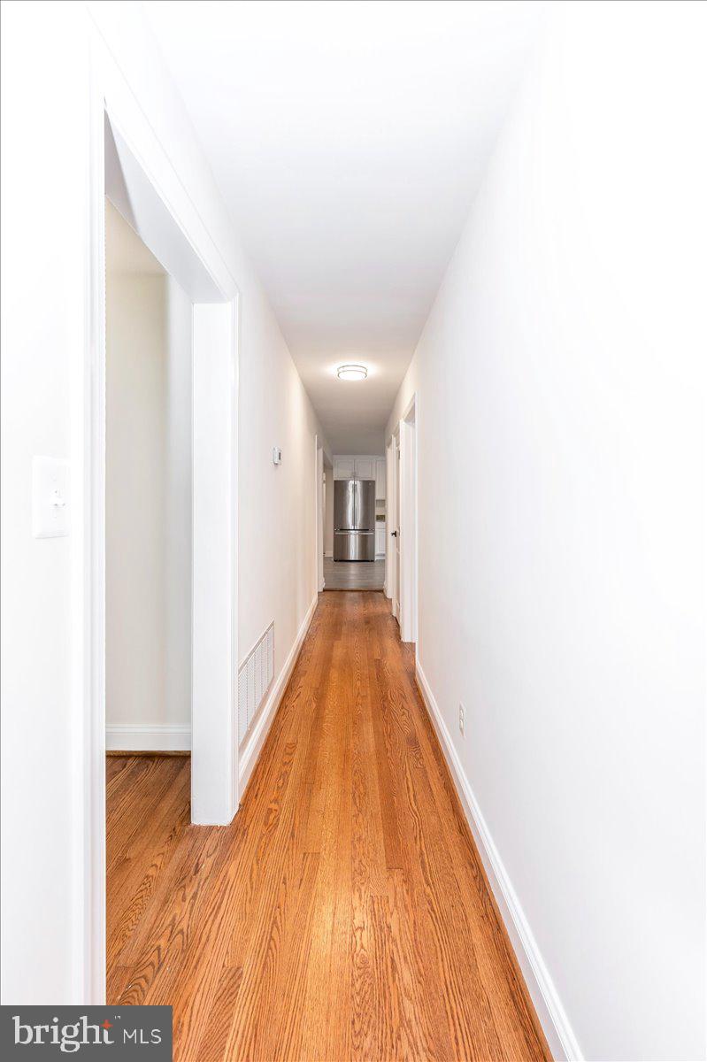 1802 Ridge Road Westminster, MD 21157 - Photo 17 of 47 a view of a hallway with wooden floor