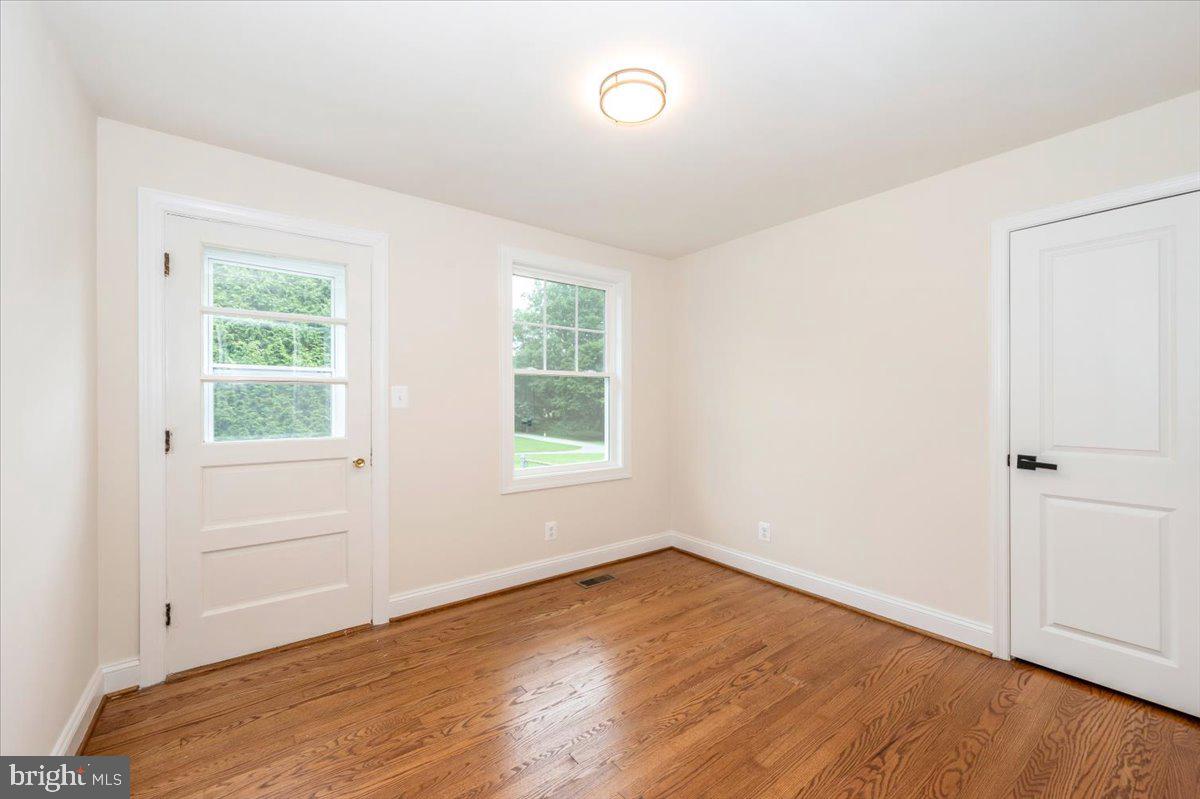 1802 Ridge Road Westminster, MD 21157 - Photo 20 of 47 an empty room with wooden floor and windows