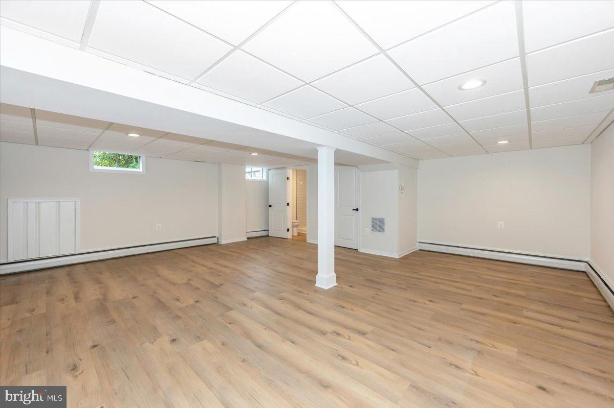 1802 Ridge Road Westminster, MD 21157 - Photo 31 of 47 a view of an empty room with wooden floor