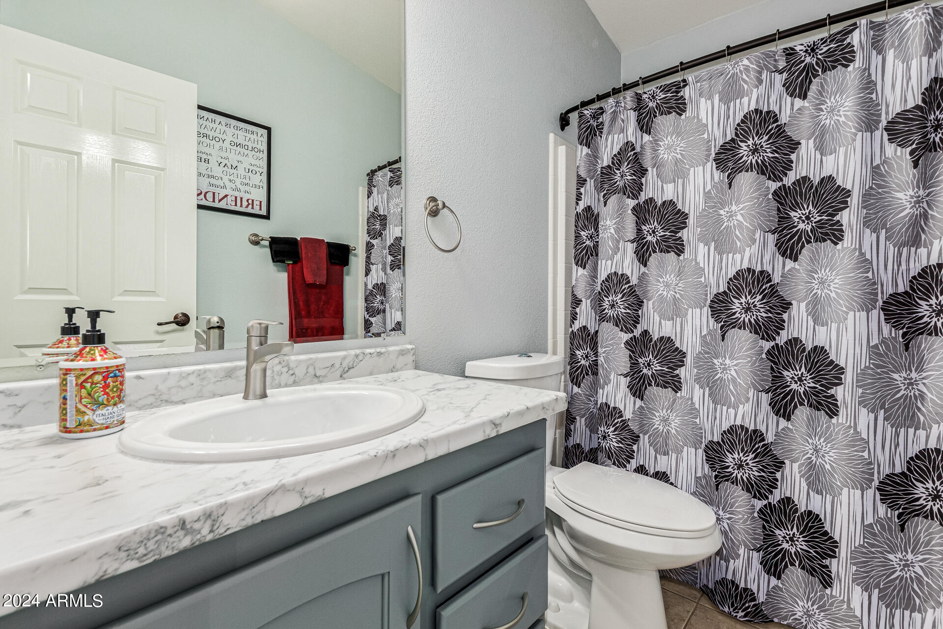 3301 South Goldfield Road, Unit 4037 Apache Junction, AZ 85119 - Photo 25 of 36 a bathroom with a granite countertop sink and a mirror