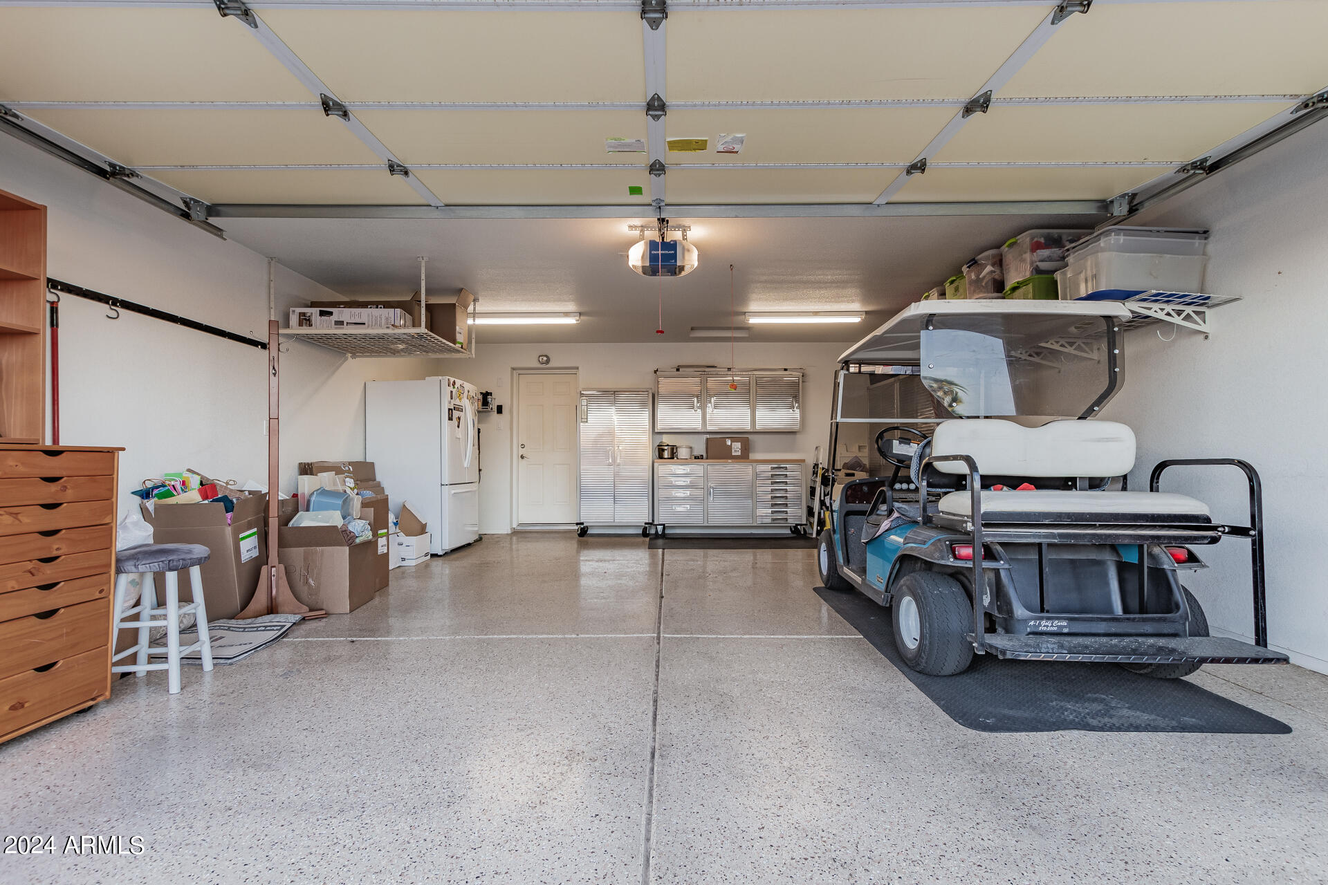3301 South Goldfield Road, Unit 4037 Apache Junction, AZ 85119 - Photo 29 of 36 a view of a garage with storage