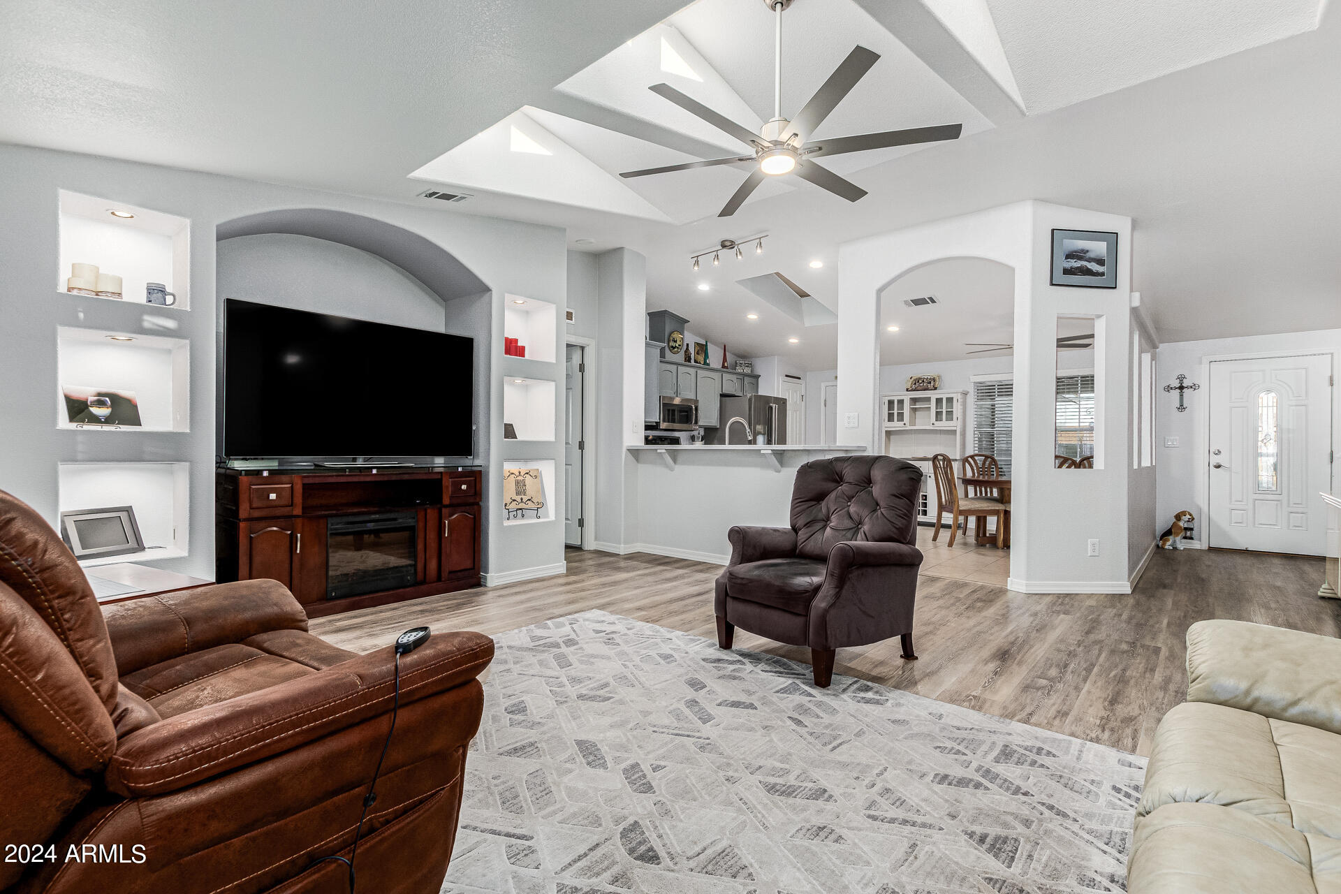 3301 South Goldfield Road, Unit 4037 Apache Junction, AZ 85119 - Photo 10 of 36 a living room with furniture and a flat screen tv