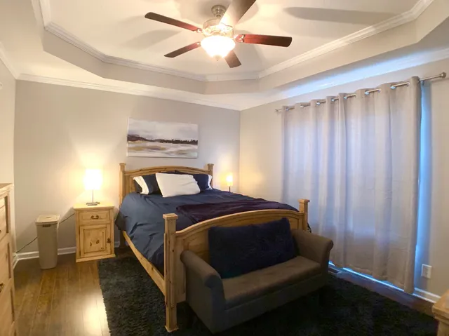 a bed room with a bed and a window