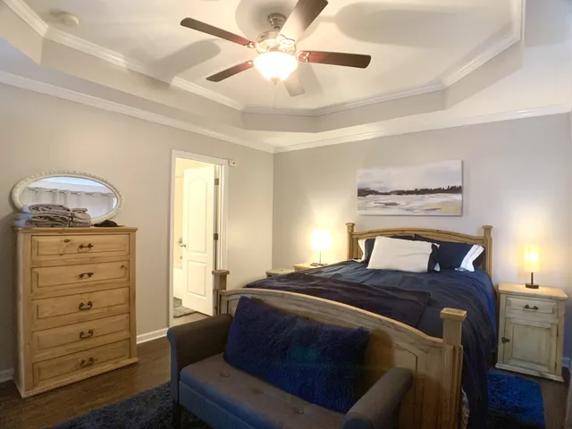 a bedroom with a bed and a dresser