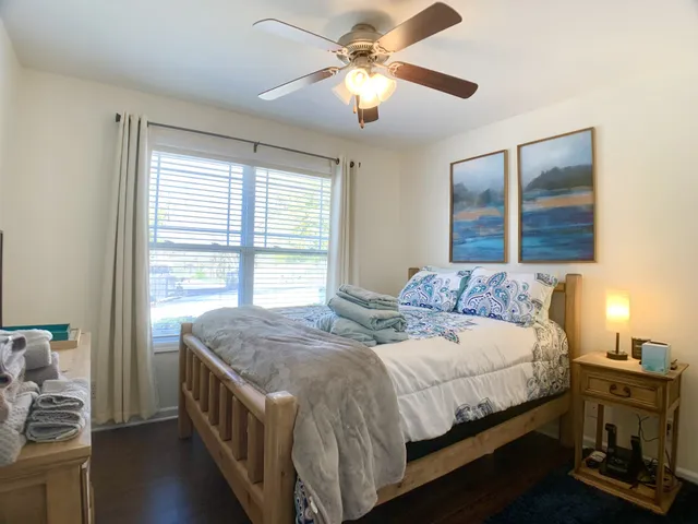 a bedroom with a bed and a window