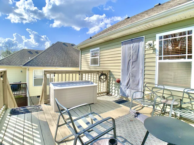 a view of a chairs and table in the balcony