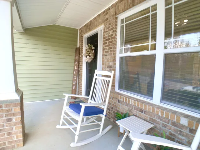 a chair and a table in a balcony