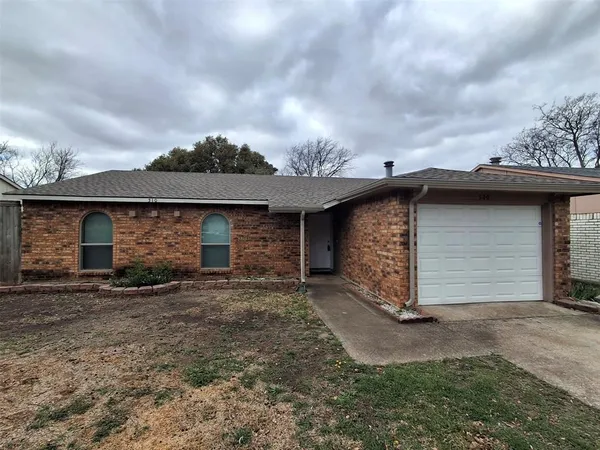 a view of a house with a yard and garage