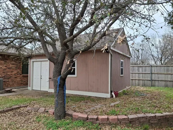 a house with trees in front of it