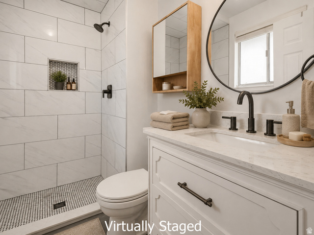 2693 Teal Way Sandy, UT 84093 - Photo 11 of 50 Bathroom vanity with a white countertop and integrated sink, matte black faucet, and a round wall mirror