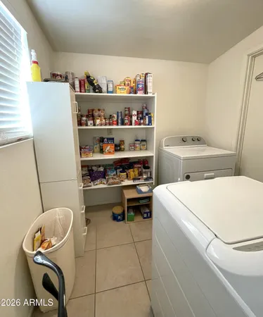 a kitchen with a refrigerator and cabinets