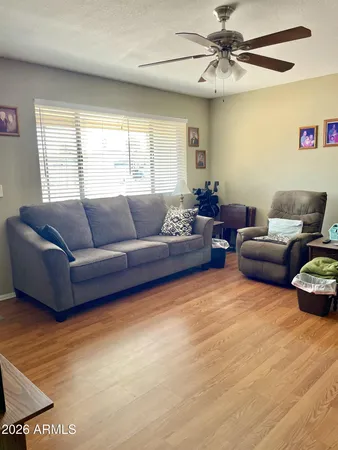 a living room with furniture and a large window
