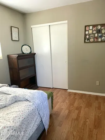 a bedroom with a bed and a table in it