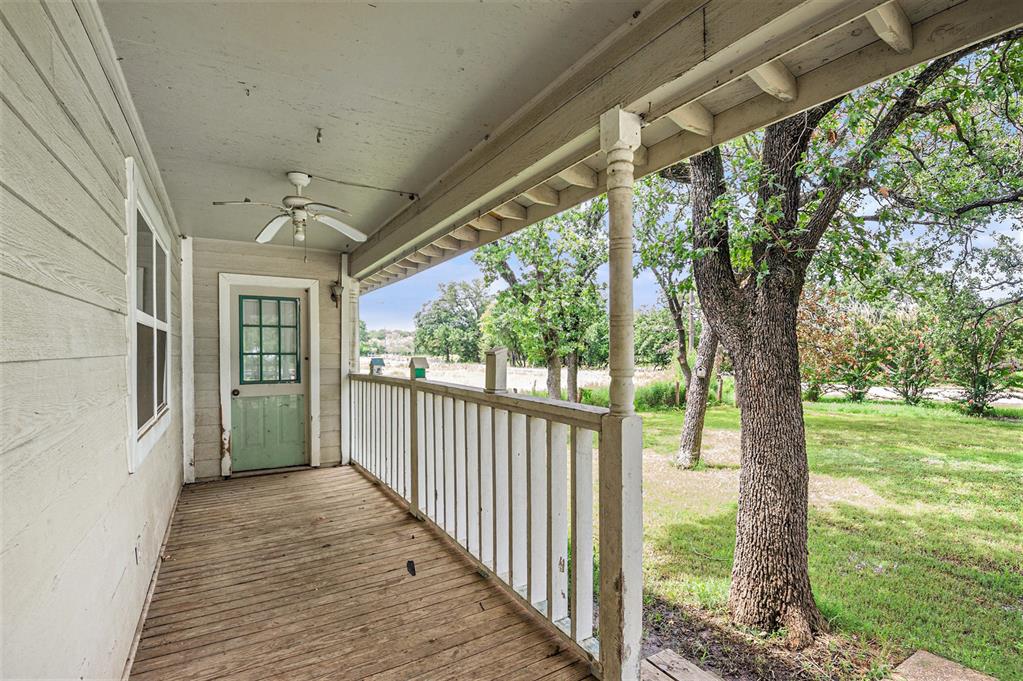 150 County 2110 Road Whitney, TX 76692 - Photo 2 of 21 a view of a porch with wooden floor and outdoor space