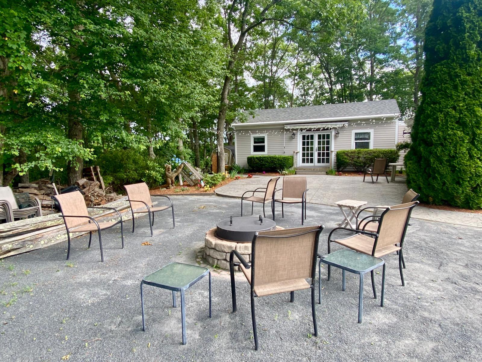 35 Parker Road, Unit 26 East Falmouth, MA 02536 - Photo 3 of 4 a view of a house with backyard and sitting area