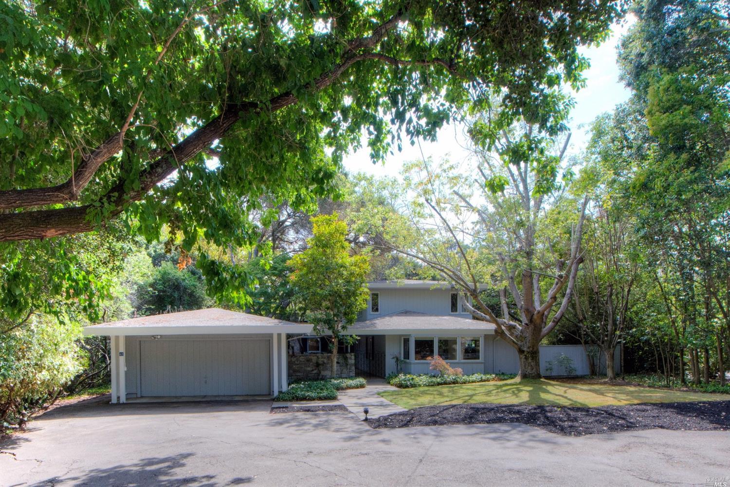 41 Moncada Way San Rafael, CA 94901 - Photo 1 of 1 a front view of a house with a garden and trees