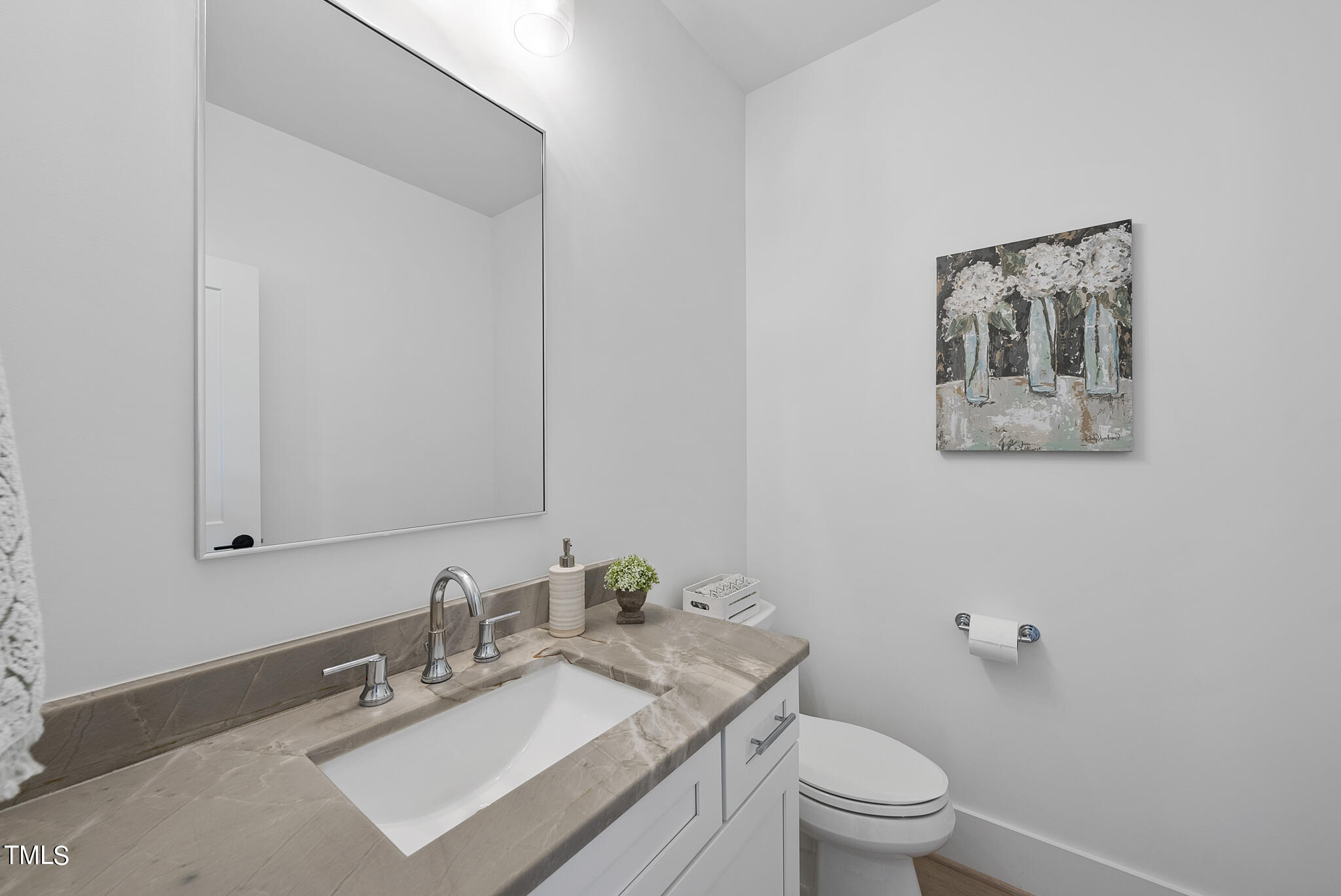 5020 Winding View Lane Raleigh, NC 27615 - Photo 29 of 63 a bathroom with a sink vanity mirror and toilet