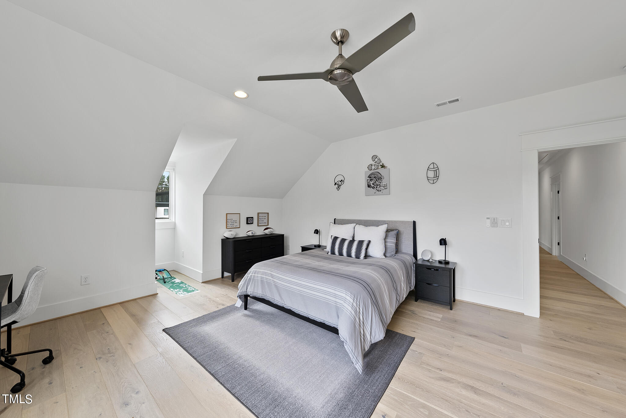 5020 Winding View Lane Raleigh, NC 27615 - Photo 46 of 63 a bedroom with a large bed and a chandelier
