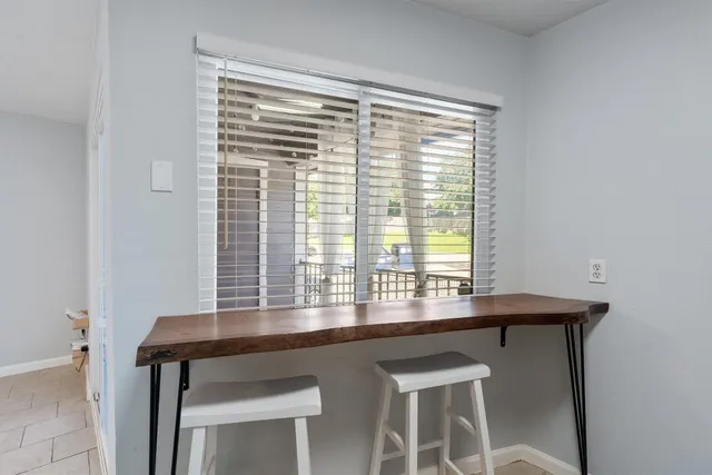 a room with a table and a window