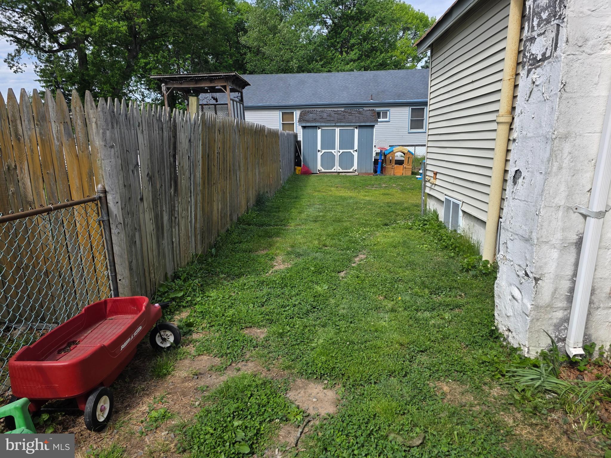 301 Franklin Street Croydon, PA 19021 - Photo 4 of 23 a view of a backyard with a small cabin and a chair
