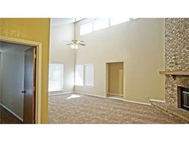 a room with a bed and a fireplace