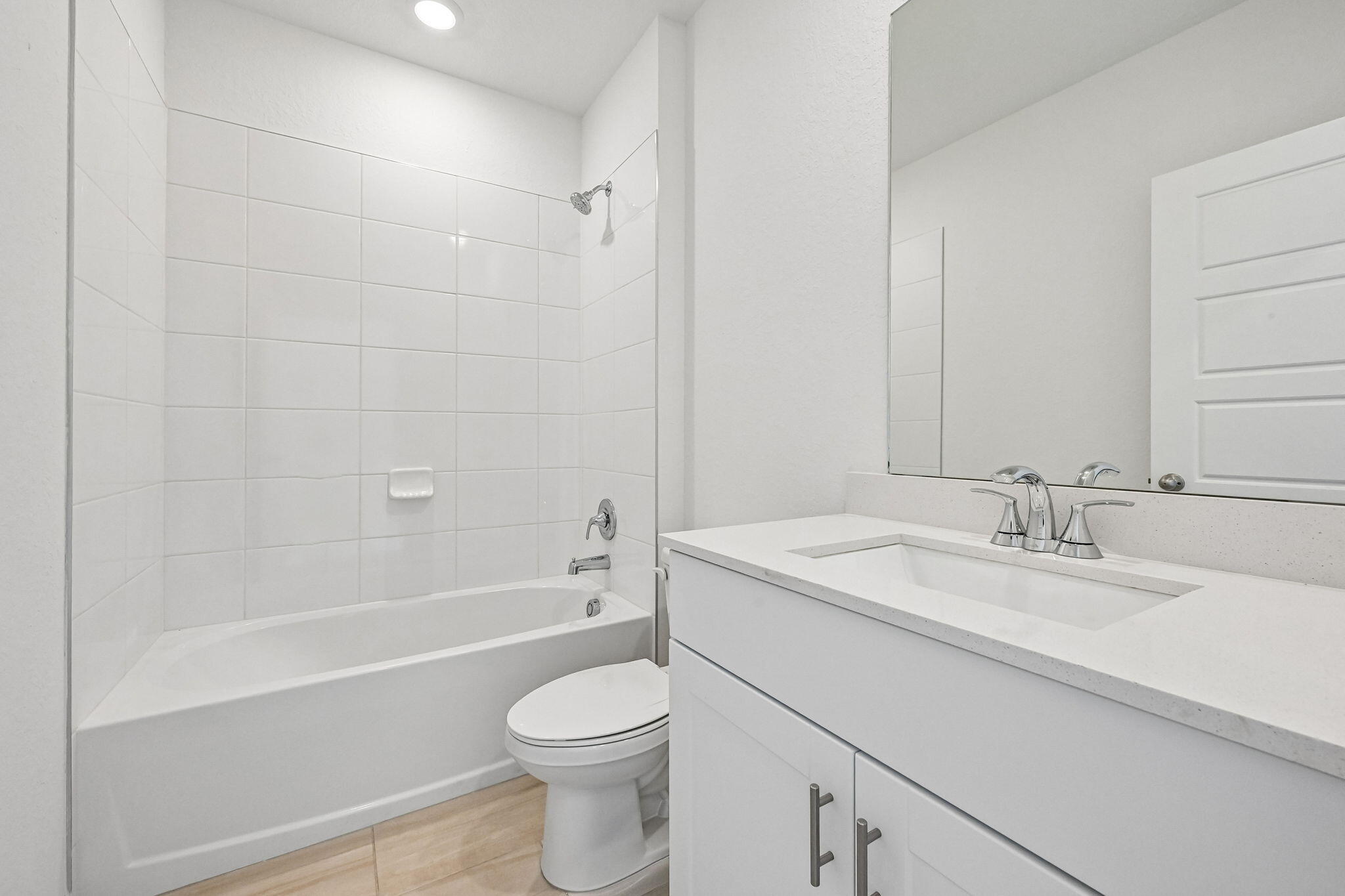 14503 Southwest New Dawn Road Indiantown, FL 34956 - Photo 19 of 42 a bathroom with a sink a toilet and a bathtub