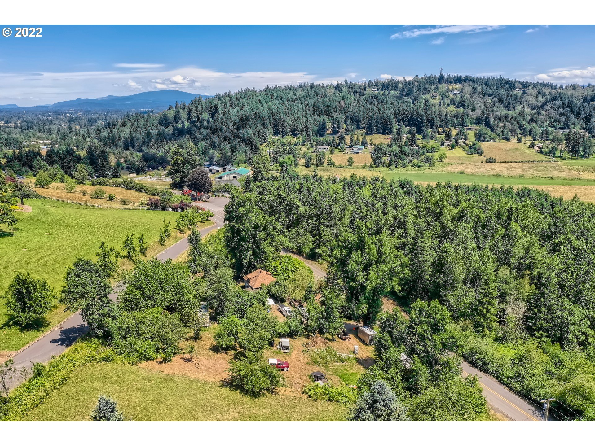 24011 Southeast Borges Road Damascus, OR 97089 - Photo 8 of 21 a view of a city with lush green forest