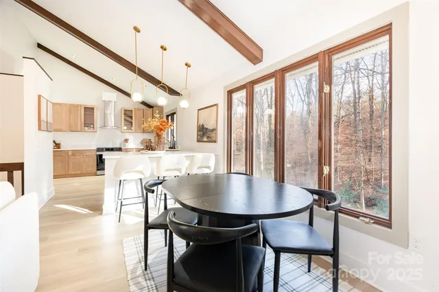 a open kitchen with dining table and chairs