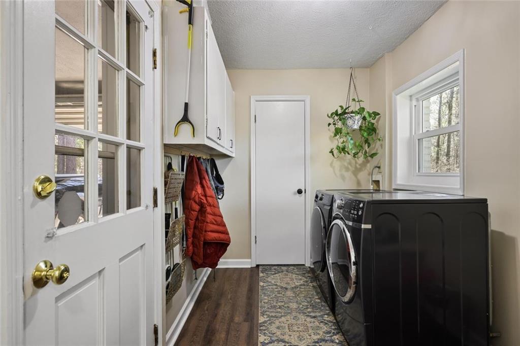 4505 Cochran Mill Road Fairburn, GA 30213 - Photo 17 of 36 a view of walk in closet with clothes and shoes