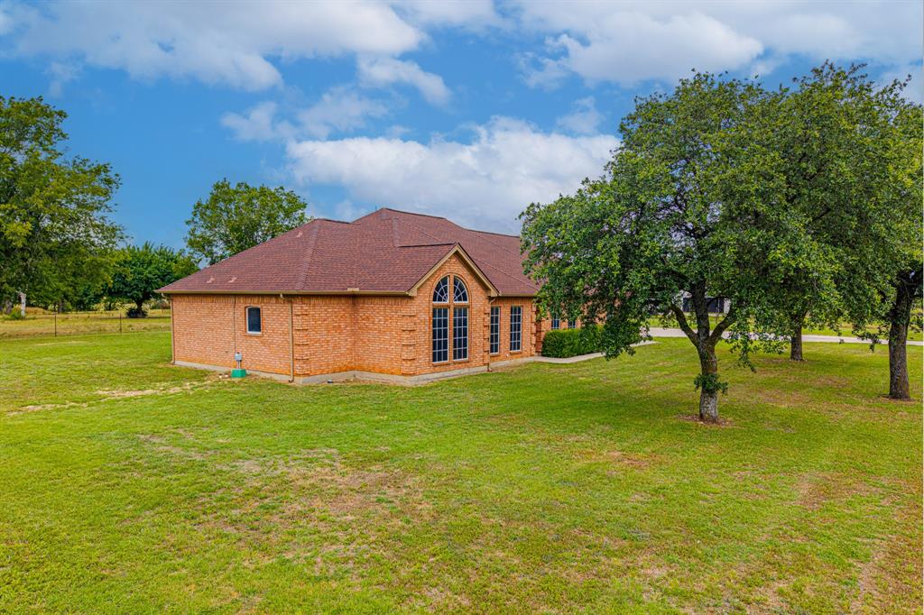 483 Christy Kay Lane Rhome, TX 76078 - Photo 35 of 40 a house with garden in front of it